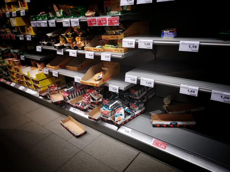 depleted grocery shelves with sold-out gaps between remaining products